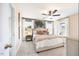 Comfortable main bedroom with neutral tones, abundant natural light, and a ceiling fan for added comfort at 201 Broomgrove Way, Wake Forest, NC 27587