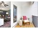 Cozy outdoor patio with chair and side table, accessible from the living area at 201 Broomgrove Way, Wake Forest, NC 27587