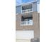 Townhome featuring a covered porch and a balcony over an attached garage at 205 Broomgrove Way, Wake Forest, NC 27587
