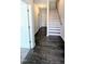 Foyer featuring wood-look flooring and a staircase with white risers at 205 Broomgrove Way, Wake Forest, NC 27587