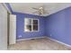 Purple bedroom with ceiling fan and closet at 210 Alfalfa Ct, Smithfield, NC 27577