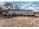 Rear view of house with wooden deck and yard at 210 Alfalfa Ct, Smithfield, NC 27577