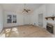 Spacious living room with a fireplace and new flooring at 210 Alfalfa Ct, Smithfield, NC 27577