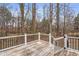 Wooden deck with a view of the backyard and wooded area at 210 Charlotte Ct, Clayton, NC 27520