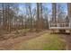 Wooden deck and spacious backyard with wooded area at 210 Charlotte Ct, Clayton, NC 27520