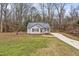 House exterior, showcasing a gray siding and dark metal roof at 210 Charlotte Ct, Clayton, NC 27520