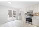 Bright kitchen with white cabinets, stainless steel appliances and access to deck at 210 Charlotte Ct, Clayton, NC 27520