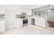 Modern kitchen with stainless steel appliances and white cabinets at 210 Charlotte Ct, Clayton, NC 27520
