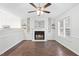 Bright living room featuring a fireplace and hardwood floors at 210 Charlotte Ct, Clayton, NC 27520