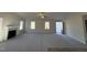 Open living room with a fireplace and carpet at 241 Magnolia Run Way, Benson, NC 27504