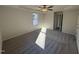 Sunlit main bedroom with ceiling fan and access to other rooms at 241 Magnolia Run Way, Benson, NC 27504