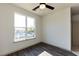 Bedroom with large window and wood flooring at 2426 Gathering Square Ct # 2426, Fuquay Varina, NC 27526