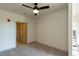 Bedroom with carpet, ceiling fan and en-suite bathroom access at 2426 Gathering Square Ct # 2426, Fuquay Varina, NC 27526