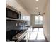 Open concept kitchen with stainless steel appliances and granite countertop at 2426 Gathering Square Ct # 2426, Fuquay Varina, NC 27526