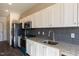 Modern kitchen with stainless steel appliances and granite countertops at 2426 Gathering Square Ct # 2426, Fuquay Varina, NC 27526