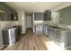 Modern kitchen with granite countertops and dark cabinets at 309 Starry Sky Dr, Benson, NC 27504