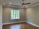 Bedroom featuring hardwood floors, recessed lighting, large window, and ceiling fan at 3913 Cedar Knolls # 7, Youngsville, NC 27596