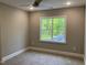 This cozy bedroom offers neutral paint and a bright window with lush treetop views at 3913 Cedar Knolls # 7, Youngsville, NC 27596