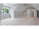 Spacious carpeted bedroom featuring a ceiling fan, large window, and an attached walk-in closet at 3913 Cedar Knolls # 7, Youngsville, NC 27596
