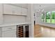 Elegant butler's pantry with sleek white cabinets, quartz counters, and a wine fridge at 3913 Cedar Knolls # 7, Youngsville, NC 27596