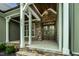 Inviting front entrance featuring a stone facade, craftsman pillars, and an elegant double door at 3913 Cedar Knolls # 7, Youngsville, NC 27596