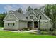 Charming exterior view of a home with gray siding, stone accents, manicured lawn and walkway at 3913 Cedar Knolls # 7, Youngsville, NC 27596