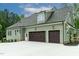Garage with three bays and dark wood doors, and concrete driveway at 3913 Cedar Knolls # 7, Youngsville, NC 27596