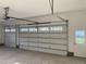 Spacious garage with bright lighting and modern insulated door at 3913 Cedar Knolls # 7, Youngsville, NC 27596