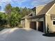 Spacious two-car garage with ample parking on a wide concrete driveway and beautiful yard with mature landscaping at 3913 Cedar Knolls # 7, Youngsville, NC 27596