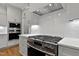Modern kitchen with a stainless steel range, subway tile backsplash, and sleek cabinetry at 3913 Cedar Knolls # 7, Youngsville, NC 27596