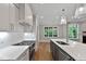 Stylish kitchen featuring a large island, stainless steel appliances, and abundant natural light at 3913 Cedar Knolls # 7, Youngsville, NC 27596