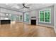 Bright living room featuring a fireplace, large windows, coffered ceiling, and seamless flow to the kitchen at 3913 Cedar Knolls # 7, Youngsville, NC 27596