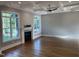 Bright living room featuring hardwood floors, fireplace, ceiling fan and coffered ceilings at 3913 Cedar Knolls # 7, Youngsville, NC 27596