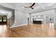 Spacious living room showcasing a coffered ceiling and hardwood floors, open to the kitchen area at 3913 Cedar Knolls # 7, Youngsville, NC 27596