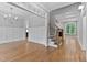 Open-concept living room with hardwood floors and stylish wainscoting at 3913 Cedar Knolls # 7, Youngsville, NC 27596