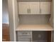 Cozy office nook with granite countertops, gray cabinetry and tiled backsplash at 3913 Cedar Knolls # 7, Youngsville, NC 27596