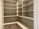 Spacious pantry with custom shelving, gray cabinetry, and quartz countertops at 3913 Cedar Knolls # 7, Youngsville, NC 27596