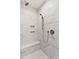 Modern bathroom features marble tile in the shower and includes a shower bench and storage niche at 3913 Cedar Knolls # 7, Youngsville, NC 27596