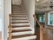 Elegant staircase with wooden treads, wrought iron railings, and a bright, open design at 3913 Cedar Knolls # 7, Youngsville, NC 27596