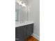 Modern bathroom vanity features white countertop and dark gray cabinets with stylish hardware at 3913 Cedar Knolls # 7, Youngsville, NC 27596