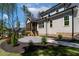 Spacious backyard with a screened porch, a patio area, and manicured landscaping at 3923 Cedar Knolls Dr # 12, Youngsville, NC 27596