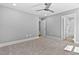 Bedroom featuring neutral walls, carpeted floors and access to ensuite at 3923 Cedar Knolls Dr # 12, Youngsville, NC 27596