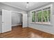 Bedroom with hardwood floors, gray walls, ceiling fan and entry door to closet at 3923 Cedar Knolls Dr # 12, Youngsville, NC 27596