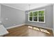 Dining room with hardwood floors, large windows, and chandelier at 3923 Cedar Knolls Dr # 12, Youngsville, NC 27596