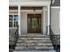 Elegant front door with stone steps, black railings, and beautiful lighting at 3923 Cedar Knolls Dr # 12, Youngsville, NC 27596