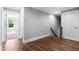 Upstairs hallway features hardwood floors and access to multiple rooms at 3923 Cedar Knolls Dr # 12, Youngsville, NC 27596