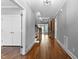Inviting hallway with hardwood floors and detailed trim, leading to living spaces at 3923 Cedar Knolls Dr # 12, Youngsville, NC 27596