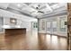 Open living room featuring a large kitchen island, modern finishes, and backyard access at 3923 Cedar Knolls Dr # 12, Youngsville, NC 27596