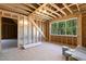 Unfinished room featuring wood flooring, LP TechShield sheathing and window with natural light at 3923 Cedar Knolls Dr # 12, Youngsville, NC 27596