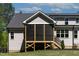 Cozy screened porch with wood frame and steps leading to the backyard at 3923 Cedar Knolls Dr # 12, Youngsville, NC 27596